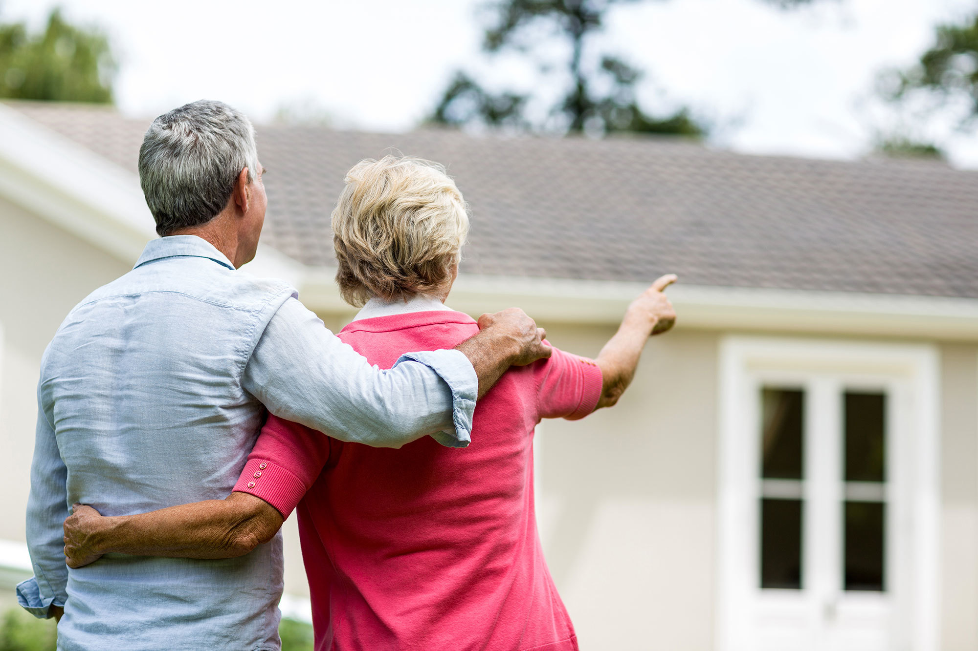 Older couple outside their retirement village