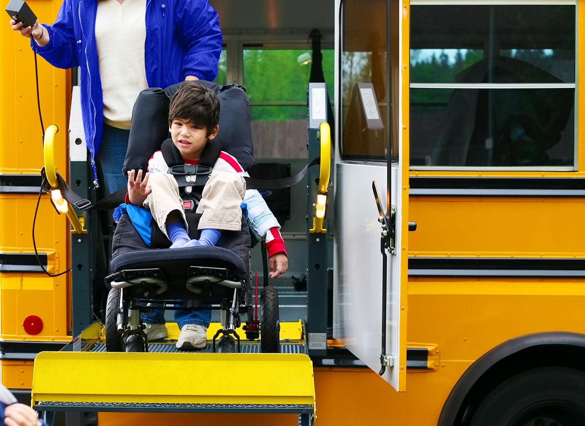 Boy in wheelchair on school bus [Source: Shutterstock]