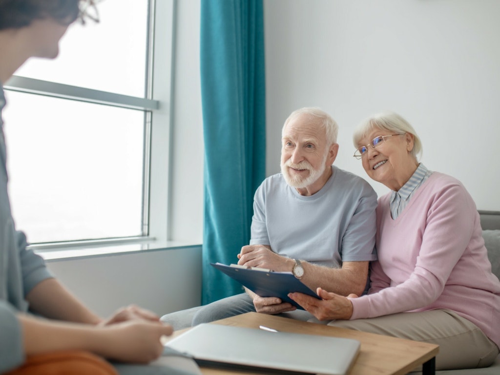 Older couple discussing their retirement plan