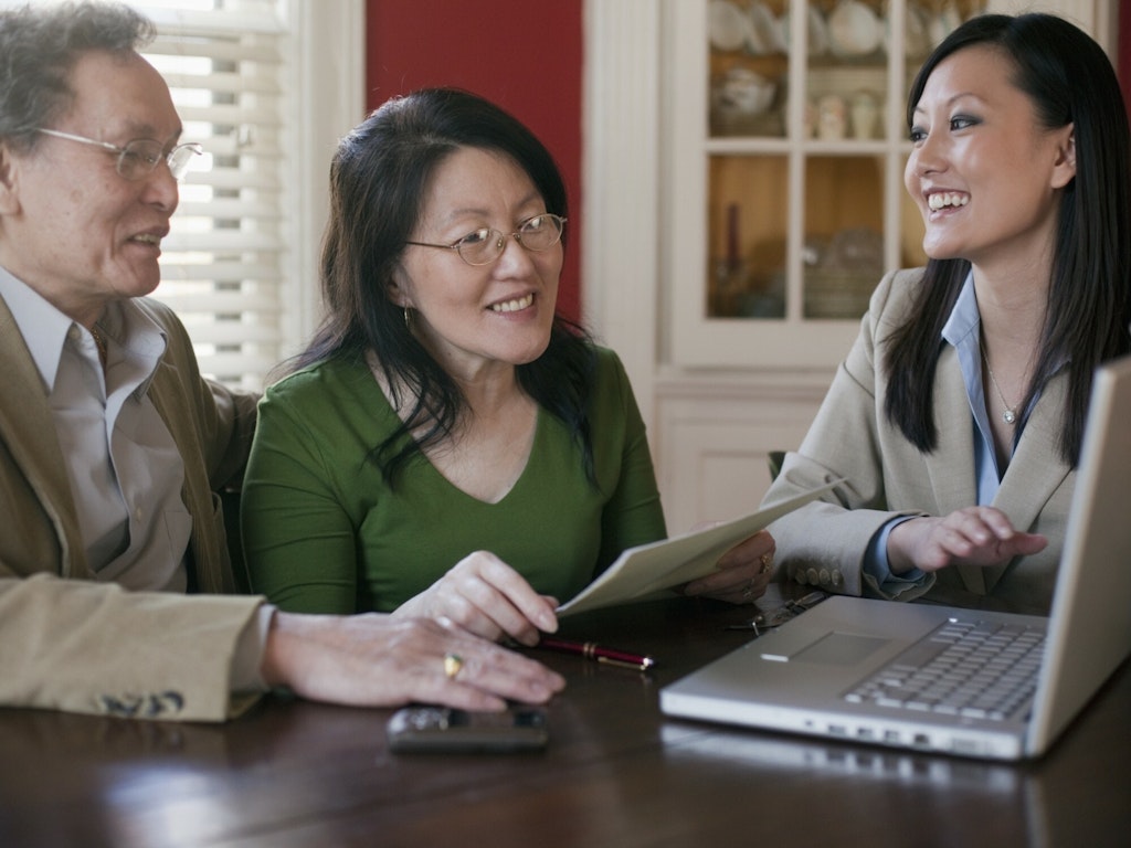 Older couple talking to financial advisor