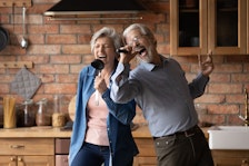 Older couple singing karaoke
